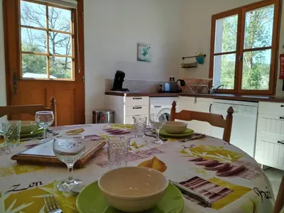 a kitchen with a table with plates and glasses on it at Sirius in Fa