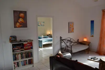 a living room with a couch and a book shelf at Sirius in Fa