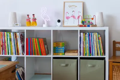 a white book shelf filled with lots of books at Abitarela - Maison d'Hôtes - B&B in Sigean