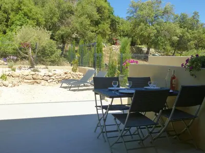 a table and chairs sitting on a patio at LE COSY GITE in Duilhac