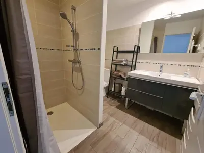 a bathroom with a shower and a sink at LE COSY GITE in Duilhac