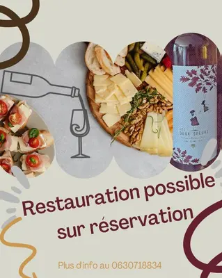 a picture of a plate of cheese and a bottle of wine at Chambre d'hôte in Cucugnan