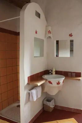 a bathroom with a sink and a tub in a room at Abbaye de Capservy in Villardonnel