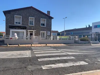 an empty parking lot in front of a building at La Turenne in Narbonne