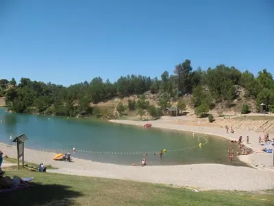 a group of people playing in the water at a beach at LE 31 in Carcassonne