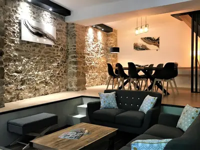 a living room with a couch and a table at La Maison Cachée in Carcassonne
