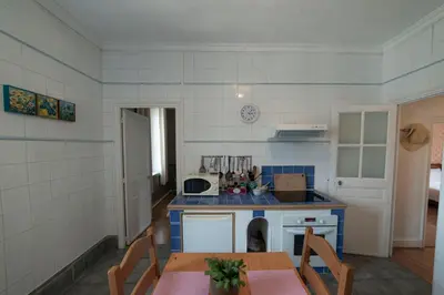 a kitchen with a table and a counter top at Appartement de 2 Chambres au 1er Etage in Carcassonne