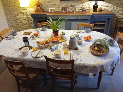 a table with a table cloth with food on it at Le Clos d'André in Castelnaudary