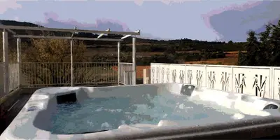 a hot tub on the roof of a house at Chambre La Caunette in La Caunette