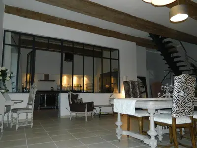 a living room with a table and some chairs at Au Paradis Cathare in Fraissé-des-Corbières