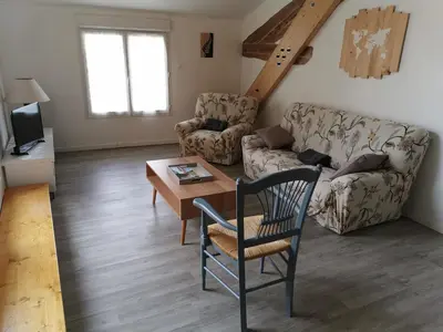 a living room with a couch and a table at La Limonadière in Port-la-Nouvelle