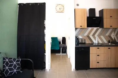 a kitchen with a sink and a counter top at le studio du Grazel in Gruissan