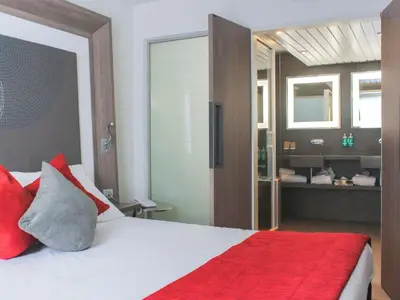 a bathroom with a white sink and a shower at Novotel Narbonne Sud A9/A61 in Narbonne
