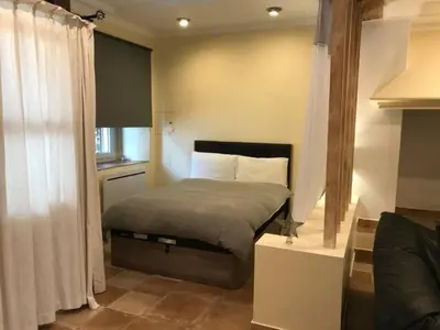 a bedroom with a bed in a room at Hibiscus House in Carcassonne