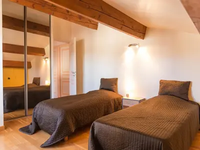 a bedroom with two beds and a mirror at Stay, Saint-André-de-Roquelongue in Saint-André-de-Roquelongue