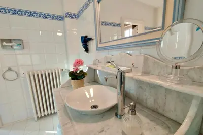 a bathroom with a sink and a mirror at Domaine de Rasigous in Saint-Affrique-les-Montagnes