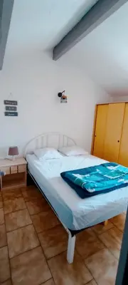 a bedroom with a bed in a room at Gite la Capelle près de Sigean Narbonne dans l'Aude à 10 min des plages Méditerranée in Roquefort-des-Corbières
