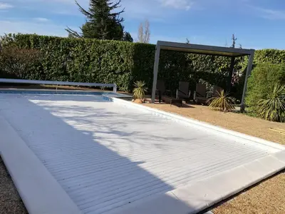 a swimming pool with a gazebo in a yard at Maison D architecte chez Huguette in Villalier