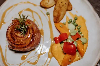 a plate of food with a shrimp and vegetables at Hôtel De France in Chalabre