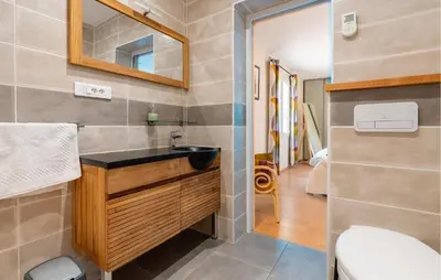a bathroom with a sink and a toilet at Amazing Home In Prades Sur Vernazobre in Prades-sur-Vernazobre