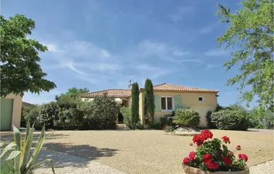 a house with some flowers in front of it at Amazing Home In Cruzy in Cruzy