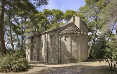 an old stone church in the middle of trees at Nice Home In Cesseras With Wifi in Cesseras