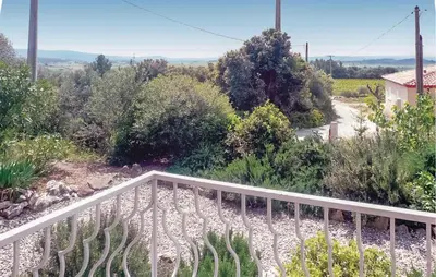 a balcony with a view of a road and trees at Nice Home In Cesseras With Wifi in Cesseras