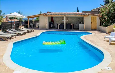 a swimming pool with a toy in the water at Nice Home In Caunes Minervois With Wifi in Caunes-Minervois