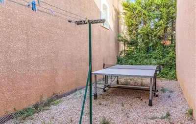 a ping pong table in front of a wall at Gorgeous Home In Cessenon Sur Orb in Cessenon