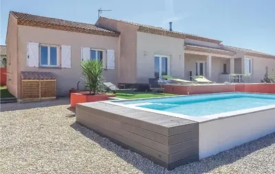 a swimming pool in front of a house at 3 Bedroom Cozy Home In Quarante in Quarante