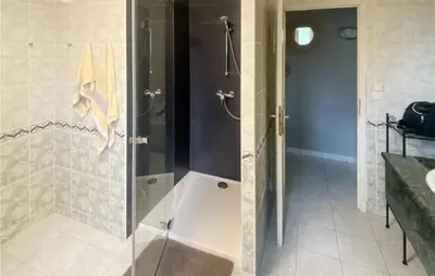 a shower with a glass door in a bathroom at 3 Bedroom Cozy Home In Quarante in Quarante
