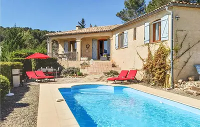 a house with a swimming pool in front of a house at Amazing Home In Cruzy in Cruzy