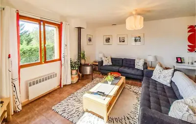 a living room with a couch and a table at Amazing Home In Cruzy in Cruzy