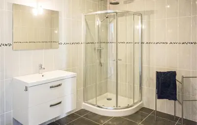 a bathroom with a shower and a sink and a toilet at 3 Bedroom Cozy Home In Caunes Minervois in Caunes-Minervois