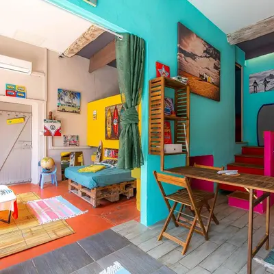 a room with a table and a bed in a room at studio domloc in Carcassonne