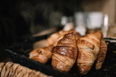 a tray of croissants and other pastries are sitting at Hôtel La Résidence in Narbonne