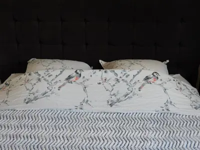 a bed with a blanket with a horse on it at Casa Del Castell in Carcassonne