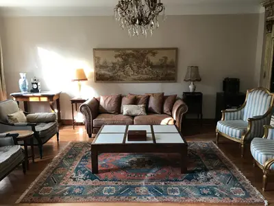 a living room with a couch and a coffee table at Residence le Petit Paradis in Labastide-Rouairoux