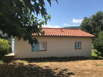 a small white house with a red roof at Maisonnette El Puy in Molitg les Bains