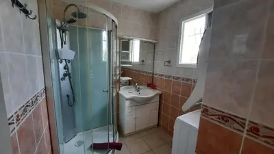 a bathroom with a shower and a sink at Lenga doc in Prades-sur-Vernazobre