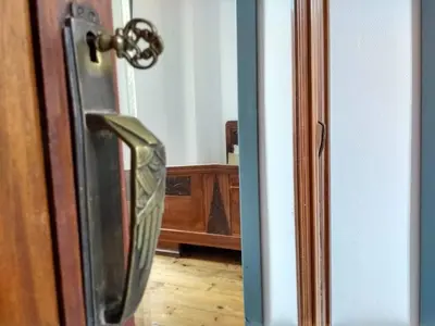 an open door with a glass doorjamming a room at Number15 Guesthouse Carcassonne in Carcassonne