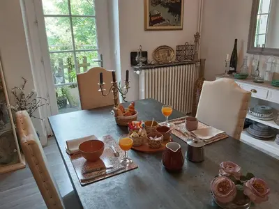 a dining room table with food and drinks on it at Burlats in Burlats