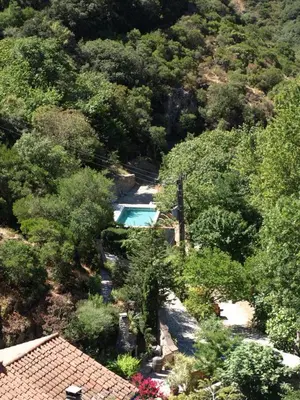 an aerial view of a house with a swimming pool at La Bergerie et La Grange du Moulin de Trédos in Vélieux