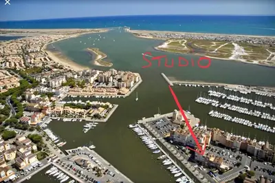 an aerial view of a harbor with a marina at Cap Gruissan Vacances (11) in Gruissan
