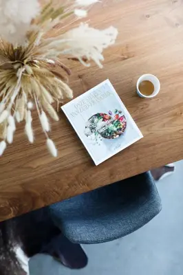 a book on a table with a donut on it at Ecole Olargues - Chambres & restaurant - Teritoria in Olargues