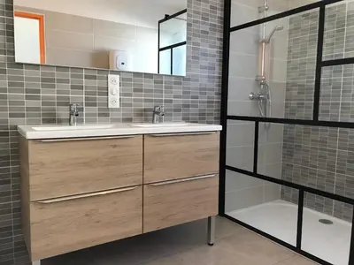 a bathroom with a sink and a shower at VILLA PINTOURINA in Sallèles-dʼAude
