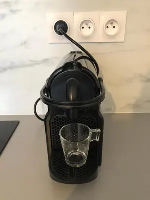 a tea kettle with a glass in it on a table at Les Palmiers de Gruissan, T2, Vue Port ! in Gruissan