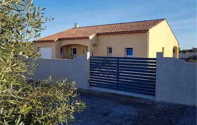 a house with a fence in front of a house at 3 Bedroom Nice Home In Quarante in Quarante