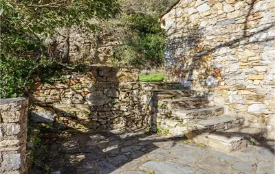 an old stone wall with some stairs next to it at 2 Bedroom Amazing Home In Olargues in Olargues