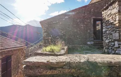 an old stone building with a window on the side at 2 Bedroom Amazing Home In Olargues in Olargues